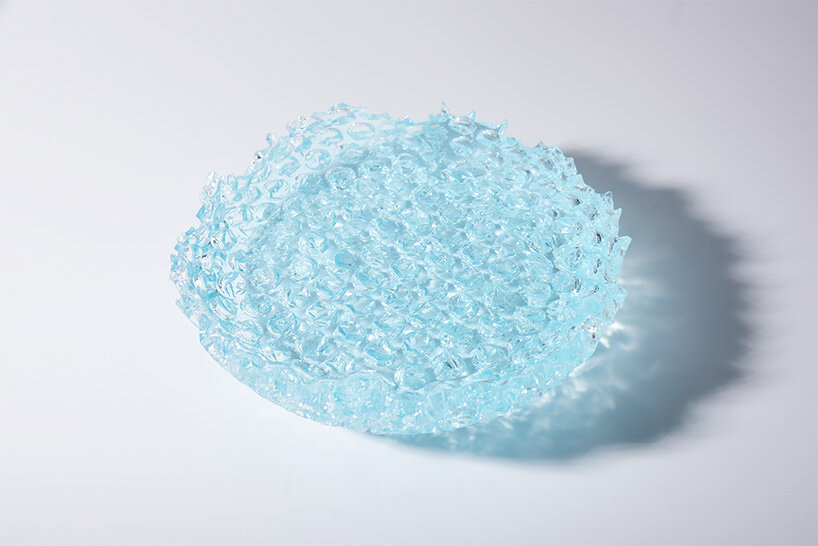 discarded plastic bags become molds for iceberg-shaped transparent objects by egosystem