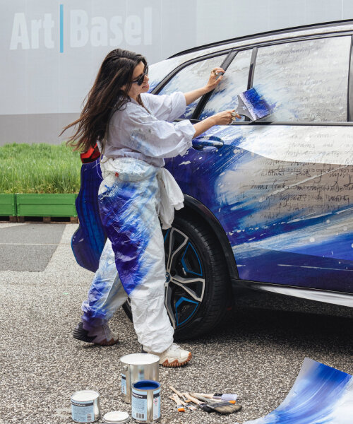 es devlin wraps pilot fleet of BMW iX5 hydrogen in blue and white collage at art basel