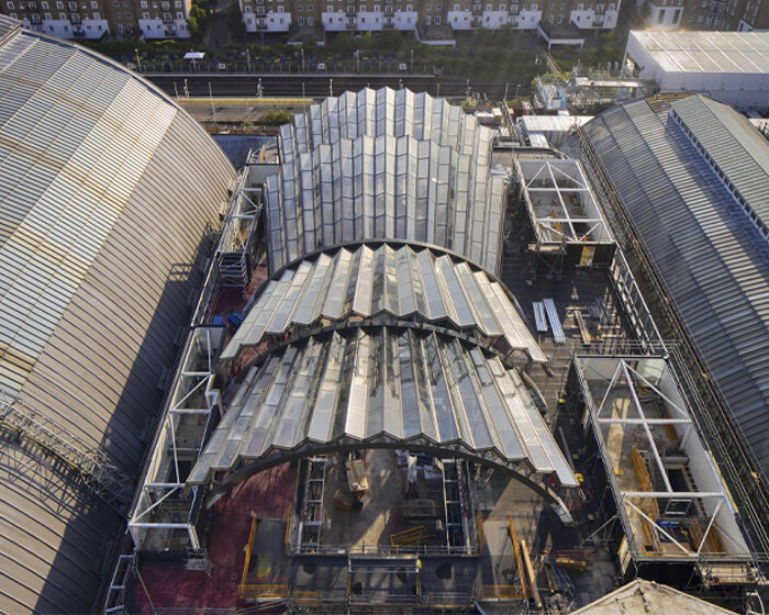 a pleated glass canopy by heatherwick studio rises amid london's olympia site