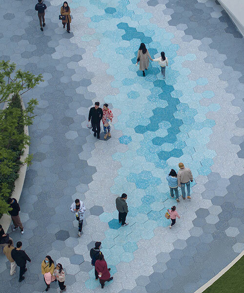 ocean wave-like paving by zaha hadid architects sweeps over chinese plaza renovation