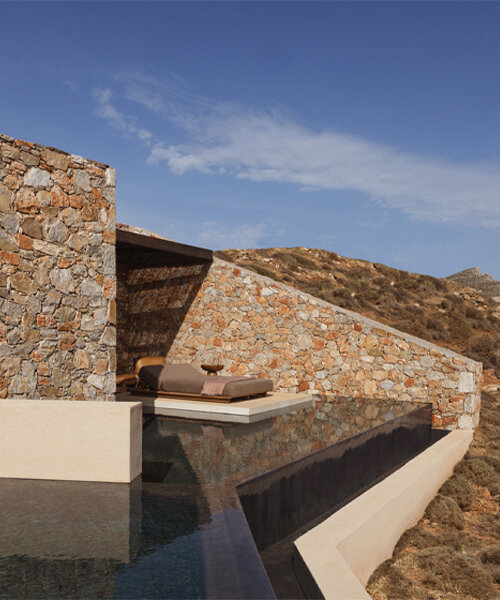 block722's gundari resort gently carves through the folegandros cliffs in greece