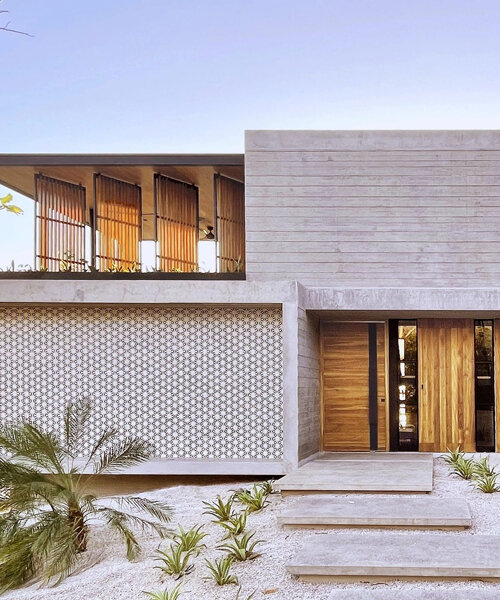 concrete residence's L-shaped infinity pool merges with costa rica's pacific coast