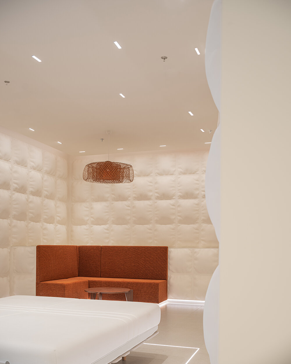 glass fiber-reinforced concrete 'pillows' clad this experience mattress store in shanghai