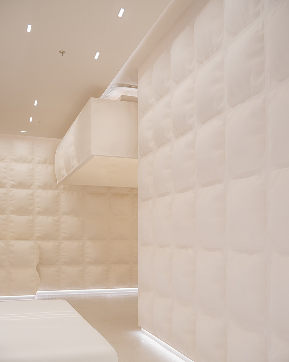 glass fiber-reinforced concrete 'pillows' clad this experience mattress store in shanghai