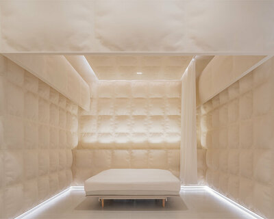 glass fiber-reinforced concrete 'pillows' clad this experience mattress store in shanghai
