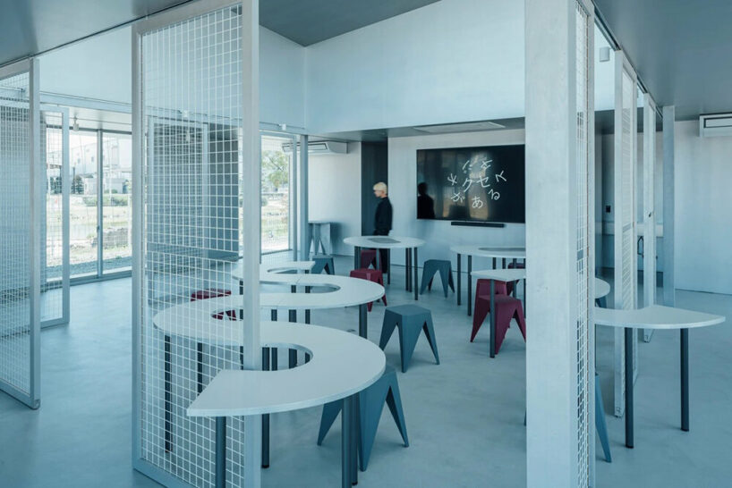 suspended wires envelop the maxell kuse ga aru studio in kyoto