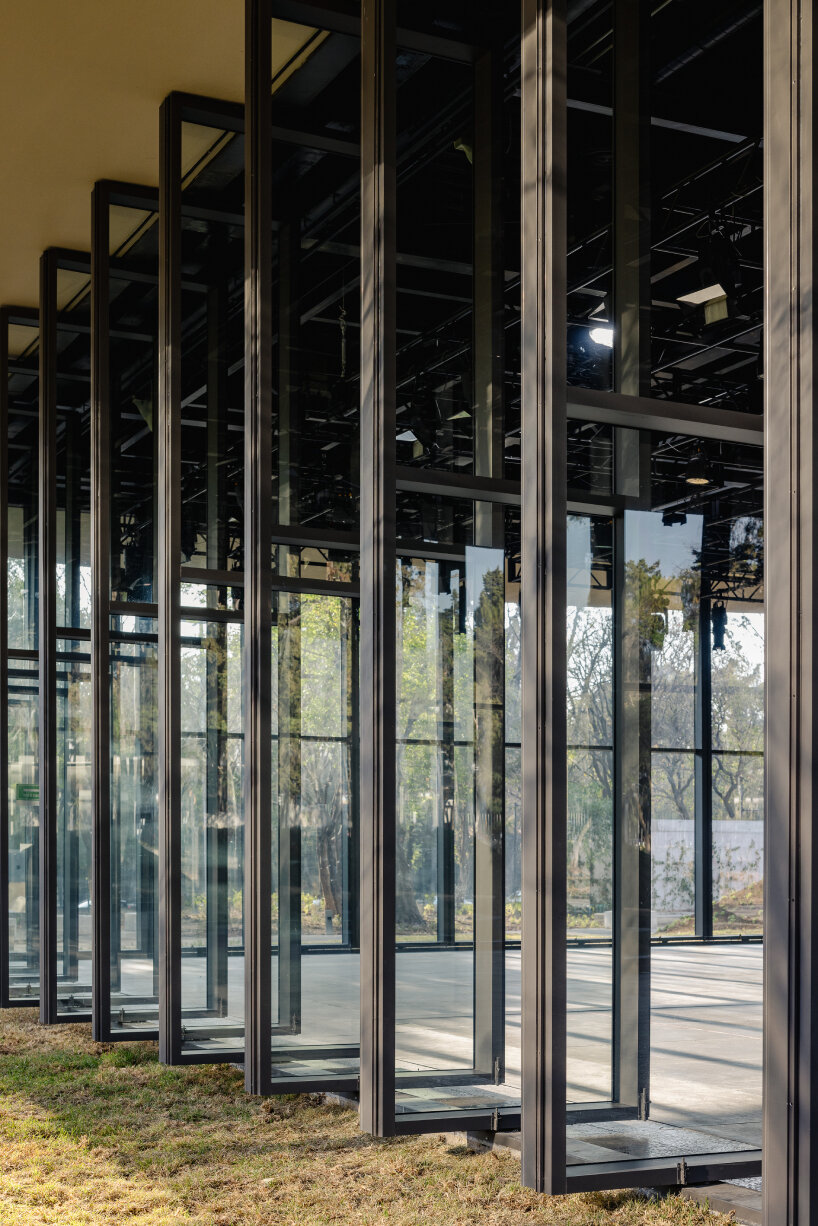 gardens, low hills, and lakes weave through michan architecture's pavilions in mexico park