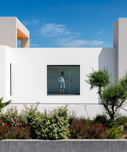 interior and exterior merge within façade studio's geometric panorama residence in greece