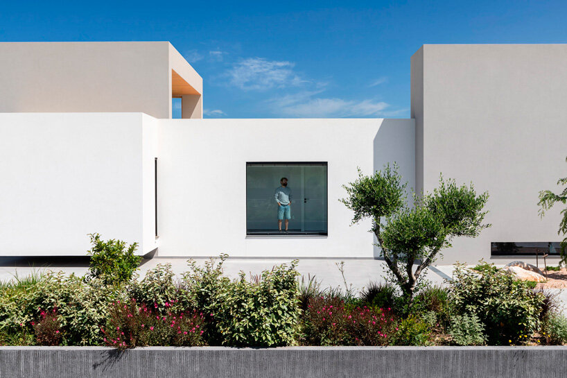 interior and exterior merge within façade studio's geometric panorama residence in greece