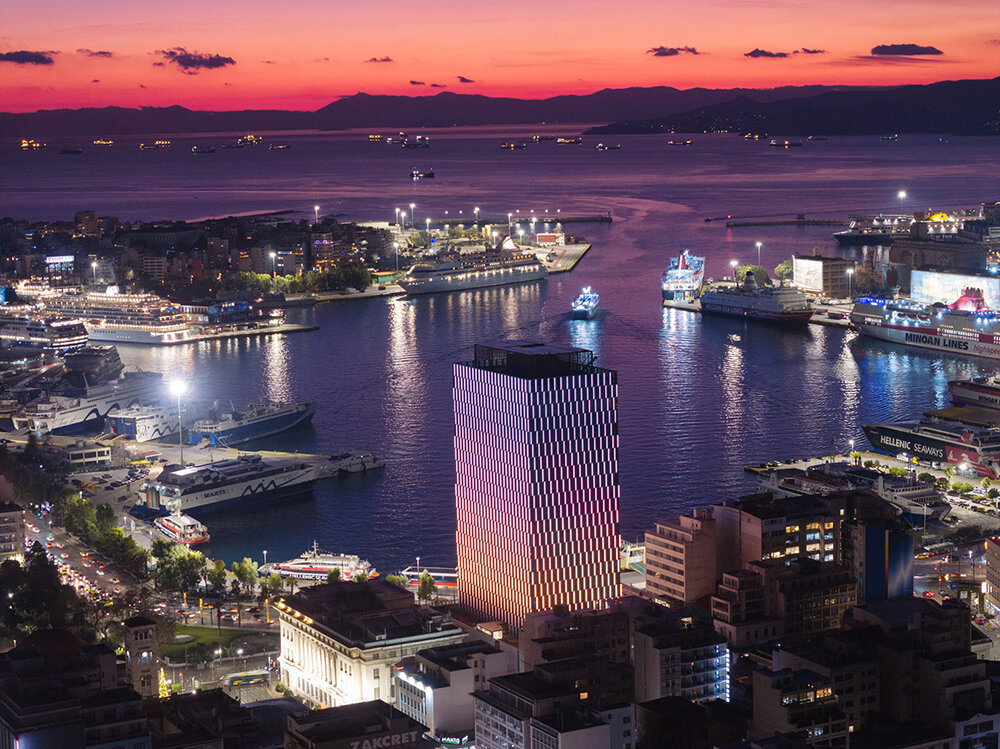 athens' piraeus tower reopens with a dynamic spring-patterned facade by PILA