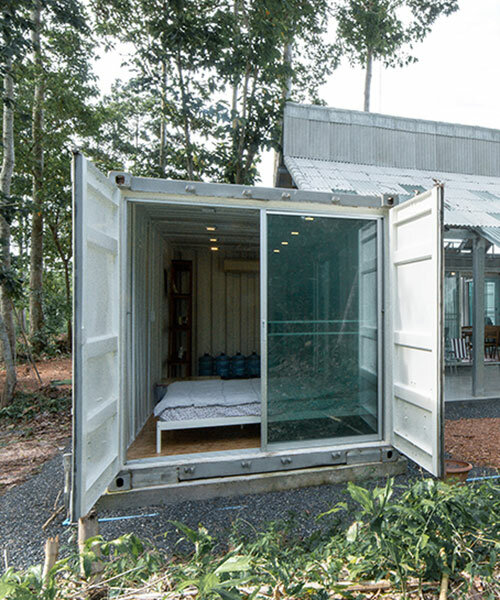 shipping containers shape see-through prefabricated residence in thai forest
