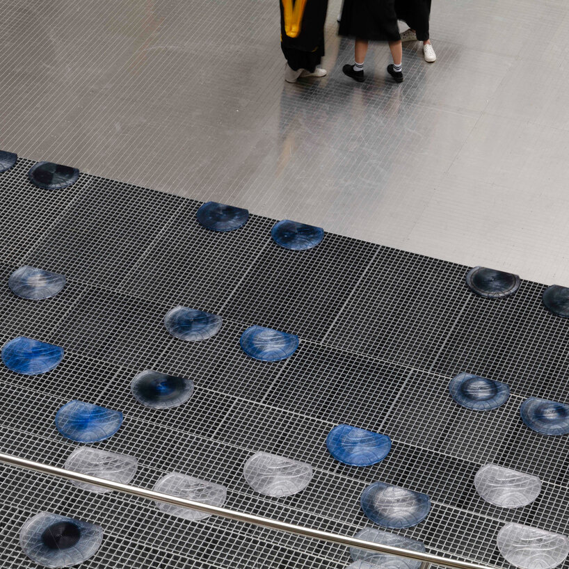 Silicon wafer-inspired memorial features raised stainless steel amphitheater in Taiwan