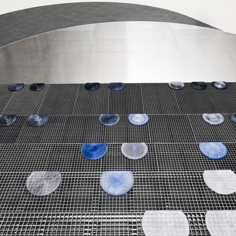 Silicon wafer-inspired memorial features raised stainless steel amphitheater in Taiwan