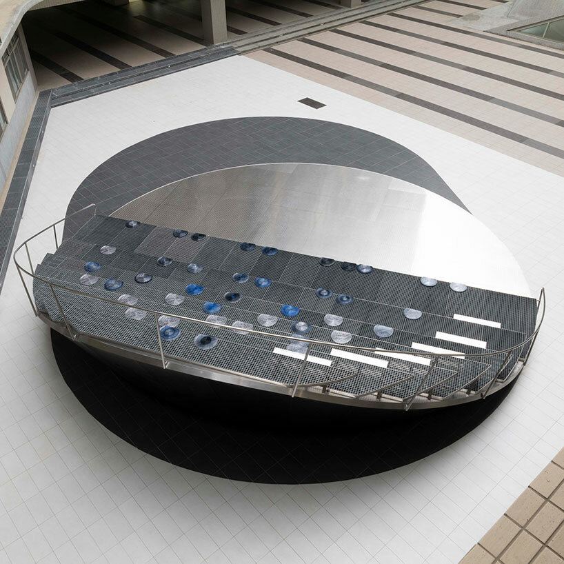 Silicon wafer-inspired memorial features raised stainless steel amphitheater in Taiwan