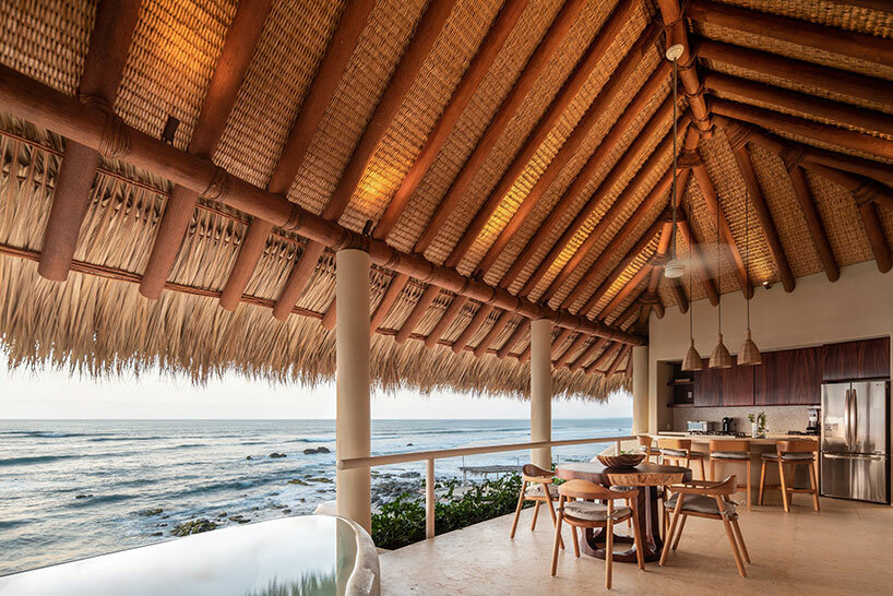 sustainable coastal housing in mexico welcomes surfers to its fluid form