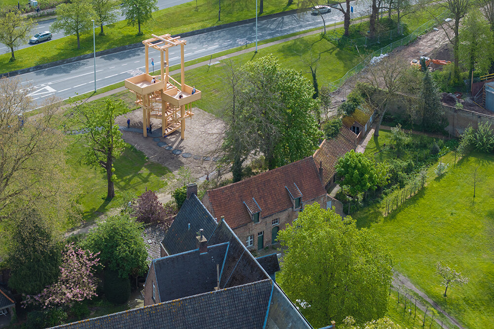 wooden 'tower of balance' by boonserm premthada emits ancient bell sounds across bruges