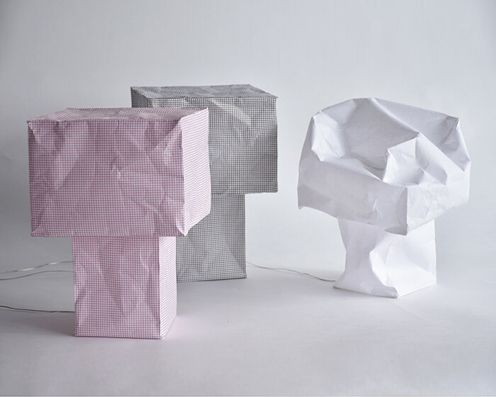 vacuum-sealed flat pack blooms into tsubomi paper lamp by kazuhiro yamanaka