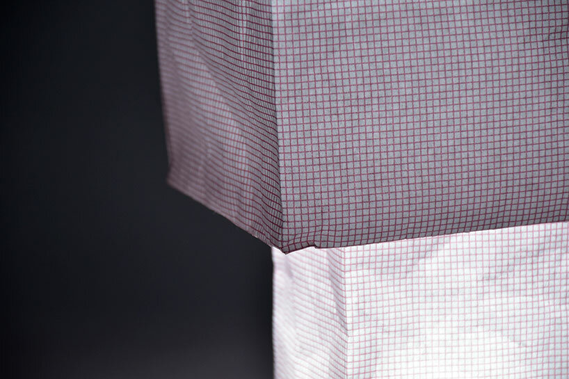 vacuum-sealed flat pack blooms into tsubomi paper lamp by kazuhiro yamanaka