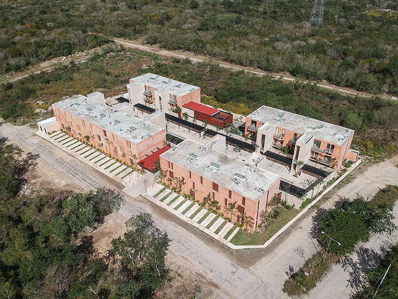 chukum, stone, and rhythmic openings shape mexican housing complex by P11 arquitectos
