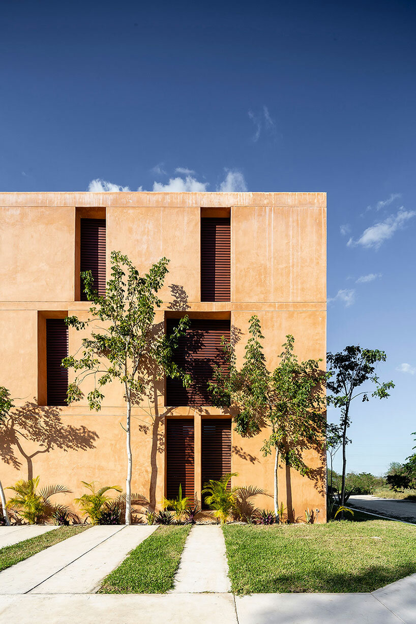 chukum, stone, and rhythmic openings shape mexican housing complex by P11 arquitectos