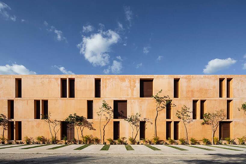 chukum, stone, and rhythmic openings shape mexican housing complex by P11 arquitectos