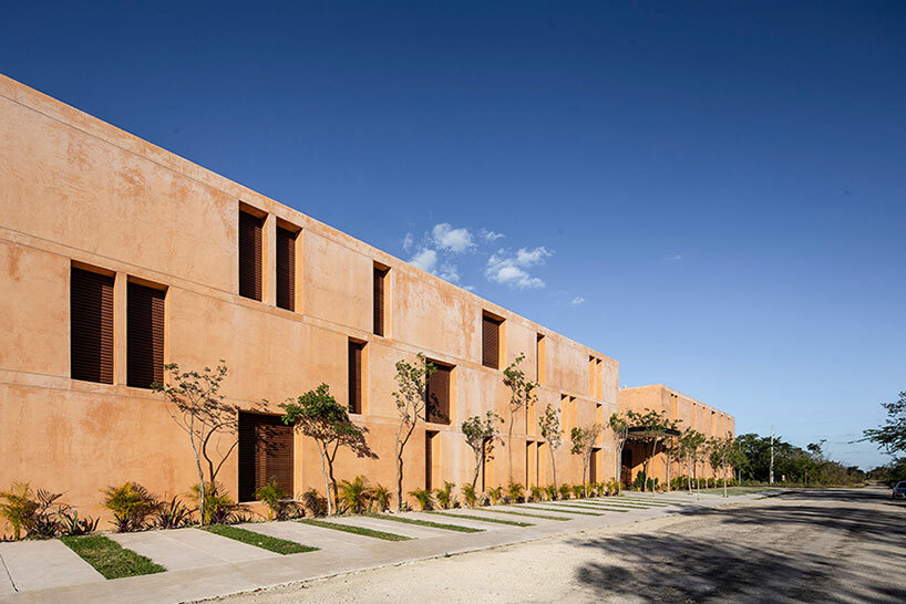 chukum, stone, and rhythmic openings shape mexican housing complex by P11 arquitectos