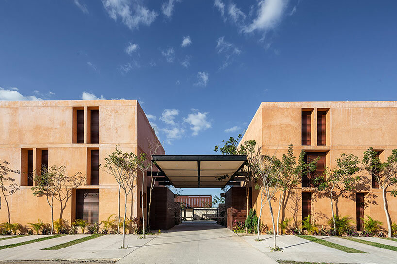 chukum, stone, and rhythmic openings shape mexican housing complex by P11 arquitectos