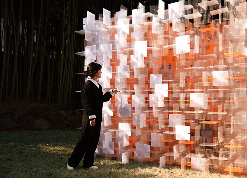 over 3,500 recyclable polycarbonate panels assemble paired cubes pavilion in korea