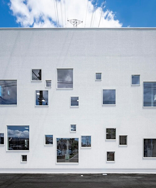 multi-sized square windows compose welfare facility's dynamic facade in japan