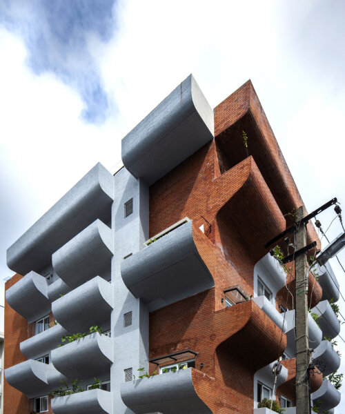 curving balconies double as environmental filters at housing complex in bangalore
