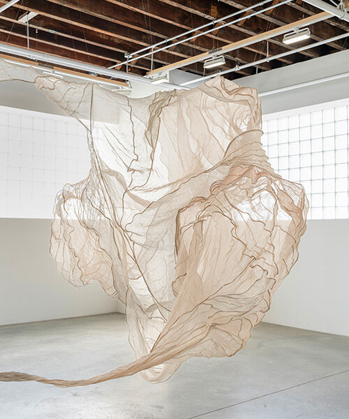 textile artist diana orving suspends silk organza installation with graceful movements