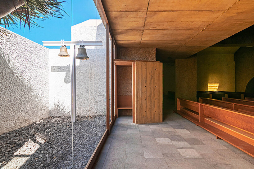beautell arquitectos' tenerife church is a pair of cyclopean concrete volumes