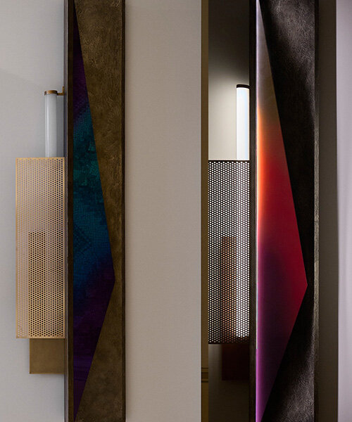 colorful mirrored wall lamp by tarek dada casts transformative reflections