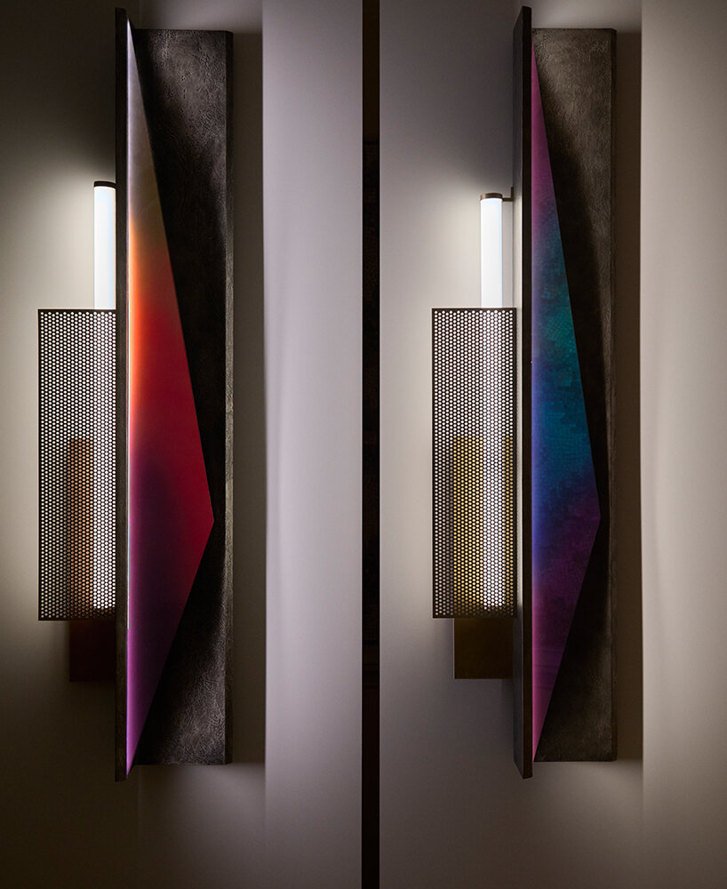 colorful mirrored wall lamp by tarek dada casts transformative reflections