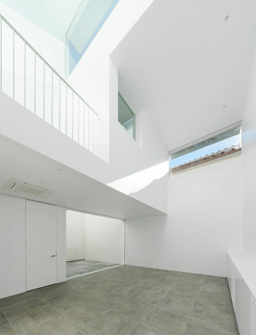 'light garden' atriums dot all-white wooden shell in japanese residence