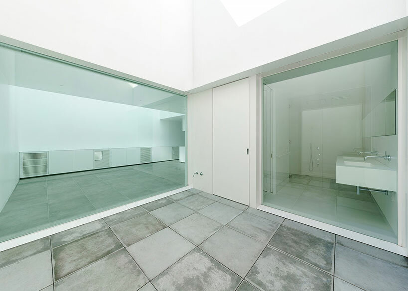 'light garden' atriums dot all-white wooden shell in japanese residence