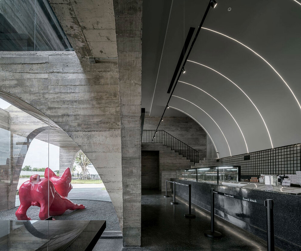 cathedral-like concrete arches punctuate TOUCH architect's french kitsch III café in thailand