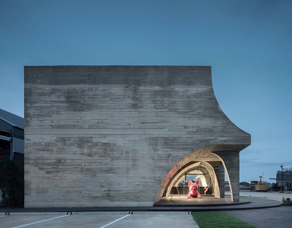 cathedral-like concrete arches punctuate TOUCH architect's french kitsch III café in thailand