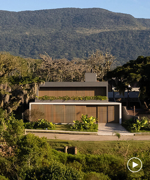 wooden sliding screens frame brazilian sunrise in family residence by studio bloco