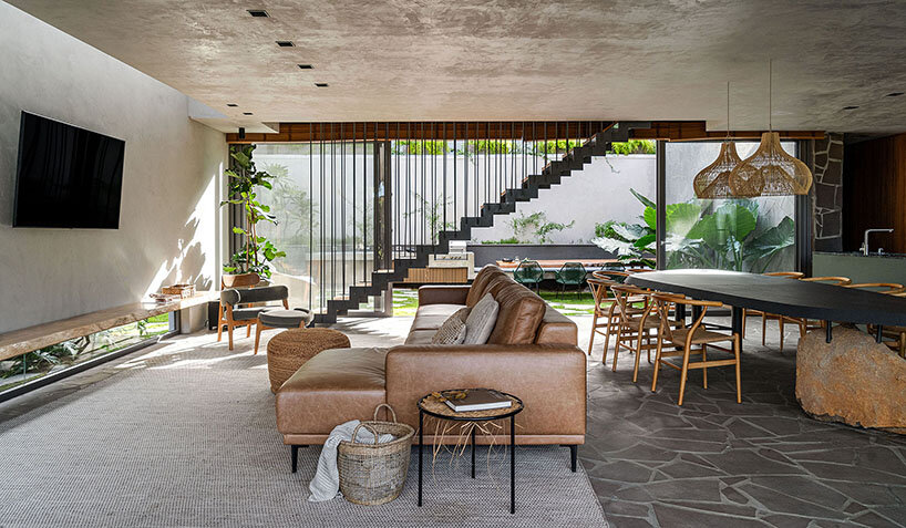 wooden sliding screens frame brazilian sunrise in family residence by studio bloco