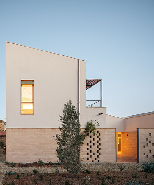 set in spain, nordest arquitectura's passive houses 1922 combine adobe, earth, and wood
