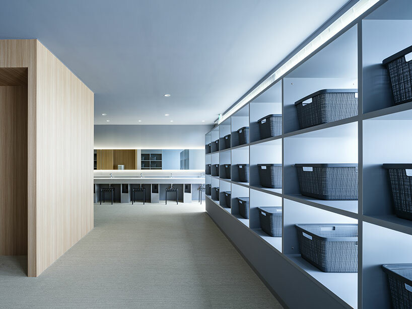 kubo tsushima architects sculpts earthy curved facade for renovated golf club in japan