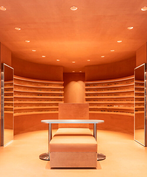 monochromatic terracotta interiors by el departamento adorn new optical boutique in spain