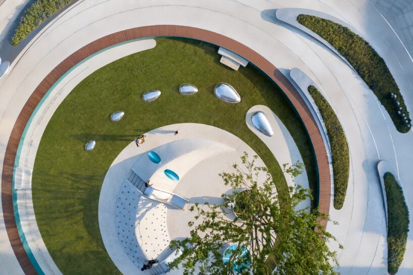 concentric pathways and gardens encircle HID's connective urban node in ...