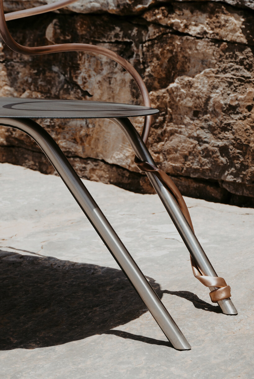 single-stroke cu.01 chair rethinks seating through metallic textures and intersecting forms