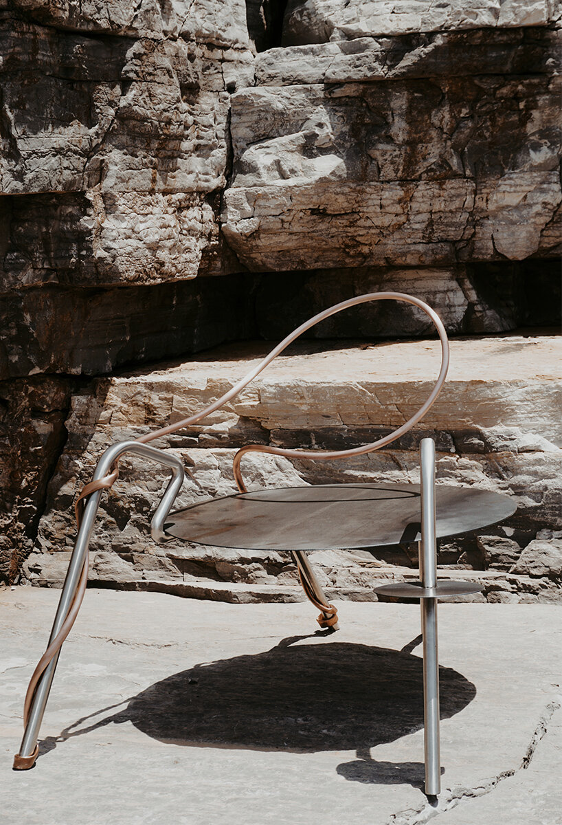 single-stroke cu.01 chair rethinks seating through metallic textures and intersecting forms