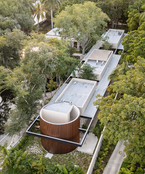 lush vegetation and stone walls enclose taller mexicano de arquitectura's hotel spa in mexico