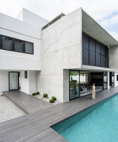 vast shuttered wall blurs thresholds at fabian tan's concrete house in kuala lumpur