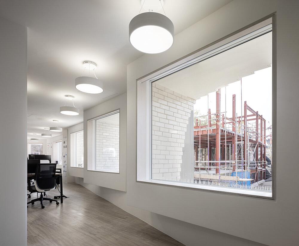 corstorphine & wright carves striking semi-circular void on office building in london