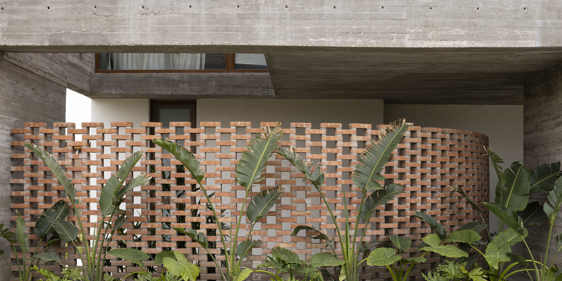 adjustable sunshades animate rustic facade in argentine residence by ...